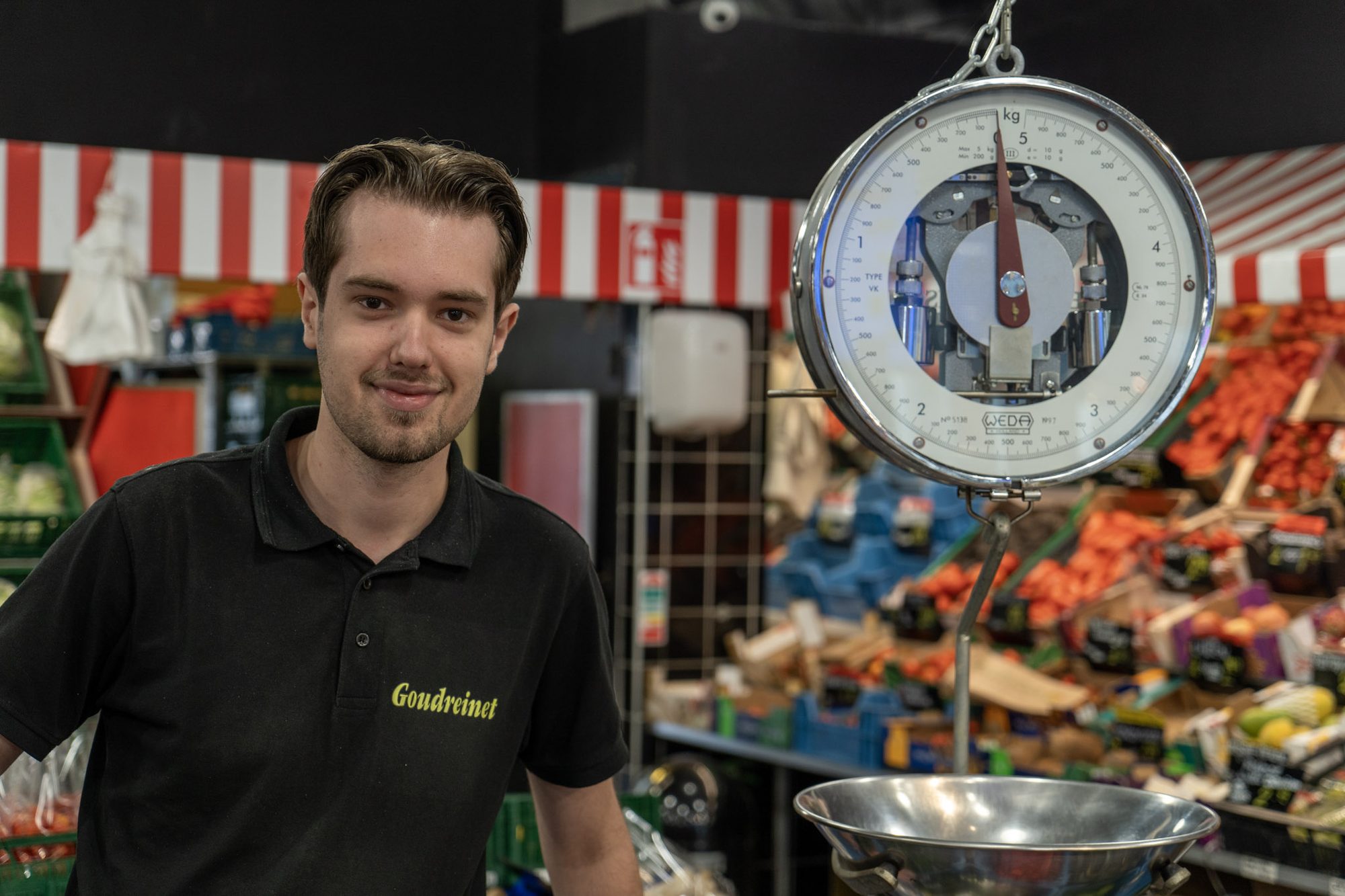 Portret van een medewerker van de Koopman Wageningen in de winkel